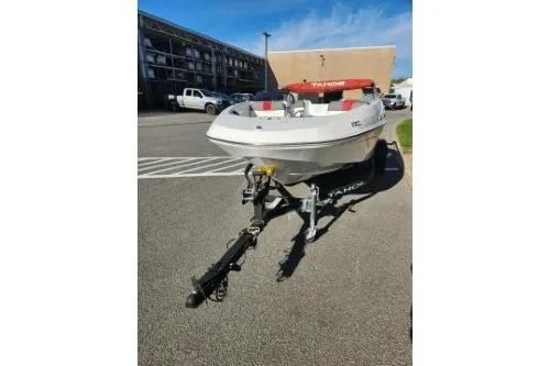 Slide: The Image of 2021 Tahoe T16 boat on trailer in parking lot, sunny day. - 5