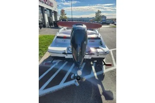 Slide: The Image of 2021 Tahoe T16 boat with outboard motor in parking lot. - 7