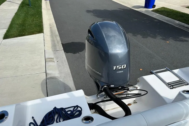 Slide: The Image of 2019 Tidewater 210 LXF boat with Yamaha 150 outboard motor on a street. - 10