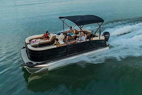 Slide: The Image of Manufacturer Provided Image: 2024 Lowe SS 230 pontoon boat cruising on a lake with passengers. - 11