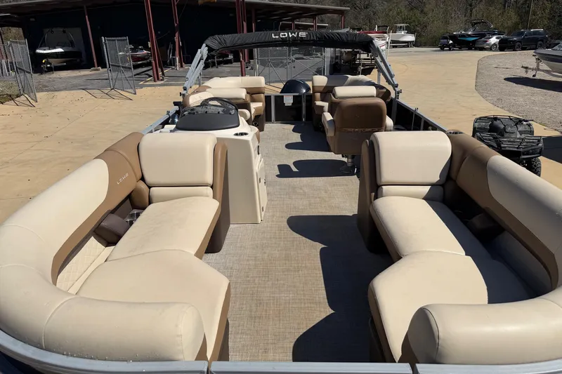 Slide: The Image of 2024 Lowe SS 230 pontoon boat with spacious seating and modern design. - 4