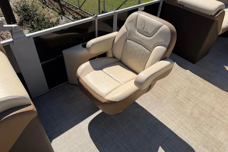 Slide: The Image of Luxurious seating on 2024 Lowe SS 230 boat, featuring beige upholstery and armrests. - 7