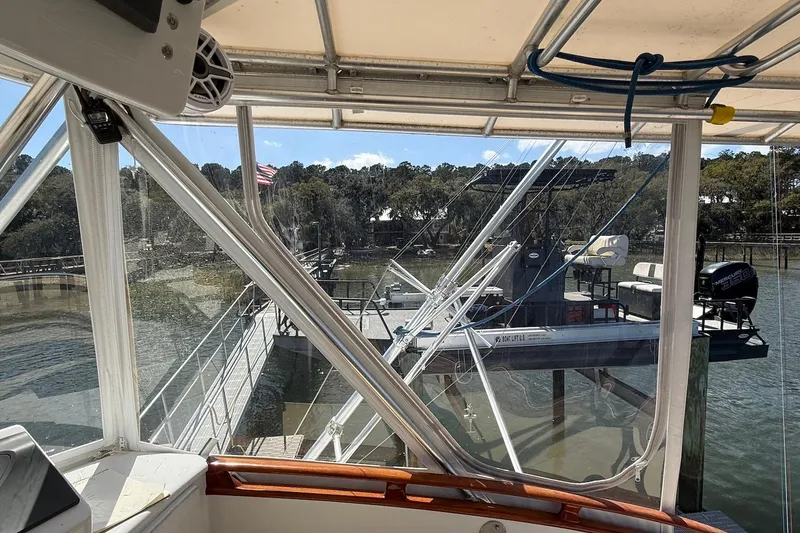Slide: The Image of 1963 Rybovich 45 Convertible boat docked at marina, view from cabin. - 16