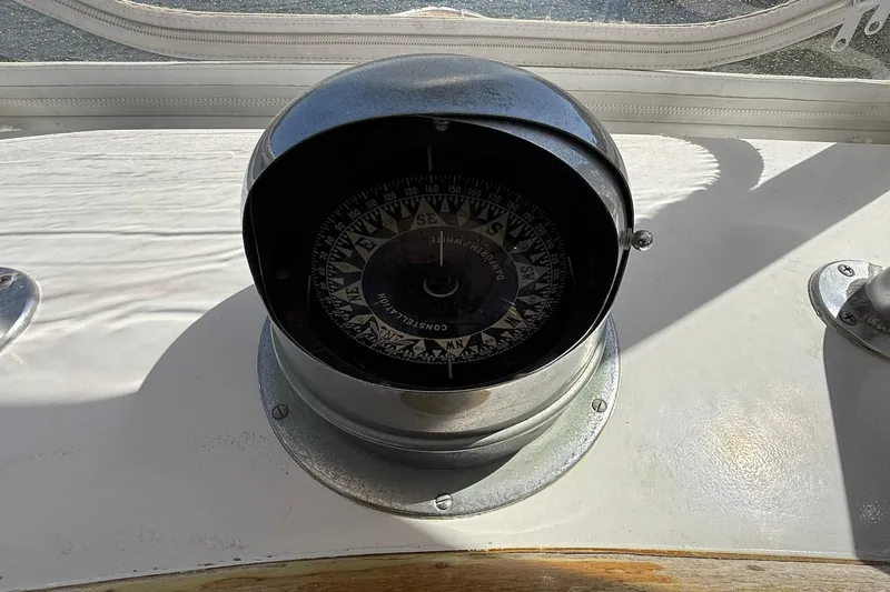Slide: The Image of Vintage compass on 1963 Rybovich 45 Convertible boat dashboard. - 28