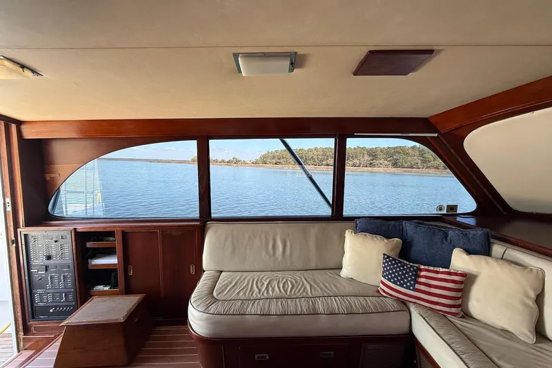 Slide: The Image of Interior of 1963 Rybovich 45 Convertible yacht with comfortable seating and scenic water view. - 32
