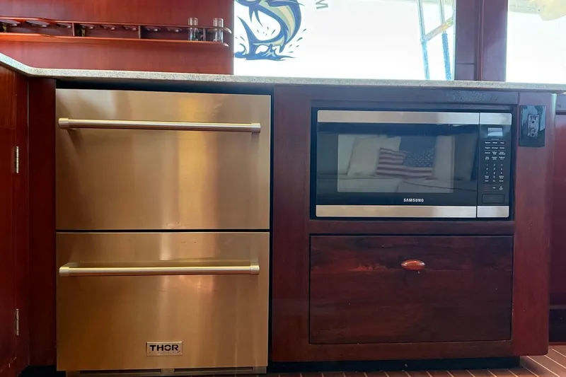 Slide: The Image of Luxury yacht kitchen with Thor refrigerator drawers and Samsung microwave, Rybovich 45 Convertible, 1963. - 36