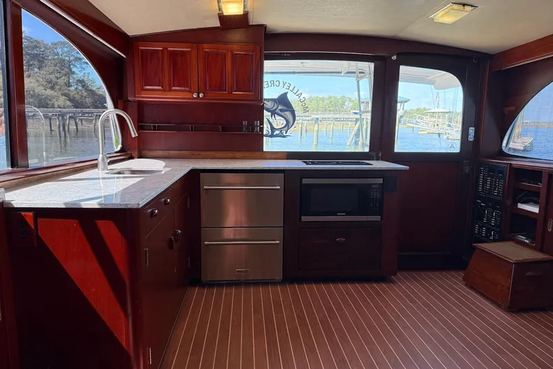 Slide: The Image of Interior of a 1963 Rybovich 45 Convertible yacht with modern kitchen amenities. - 37
