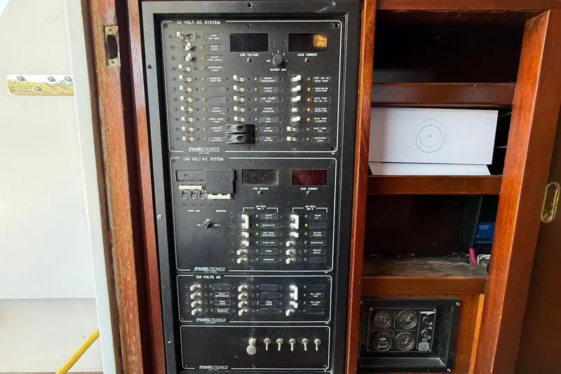 Slide: The Image of Electrical panel on a 1963 Rybovich 45 Convertible boat, featuring various switches and controls. - 38