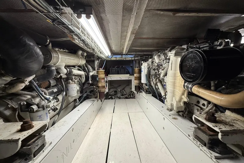 Slide: The Image of Engine room of a 1963 Rybovich 45 Convertible boat, showcasing mechanical components. - 55