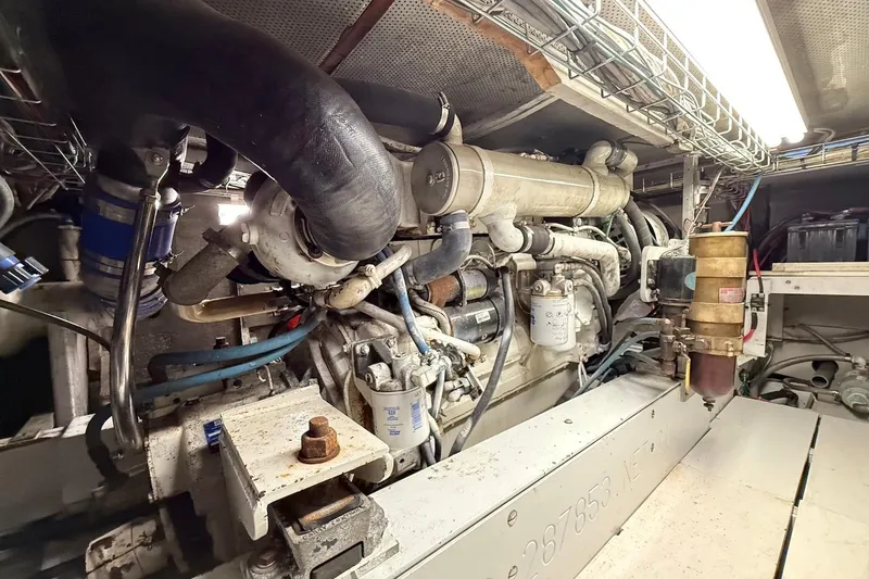 Slide: The Image of Engine room of a 1963 Rybovich 45 Convertible boat, showcasing mechanical components. - 56