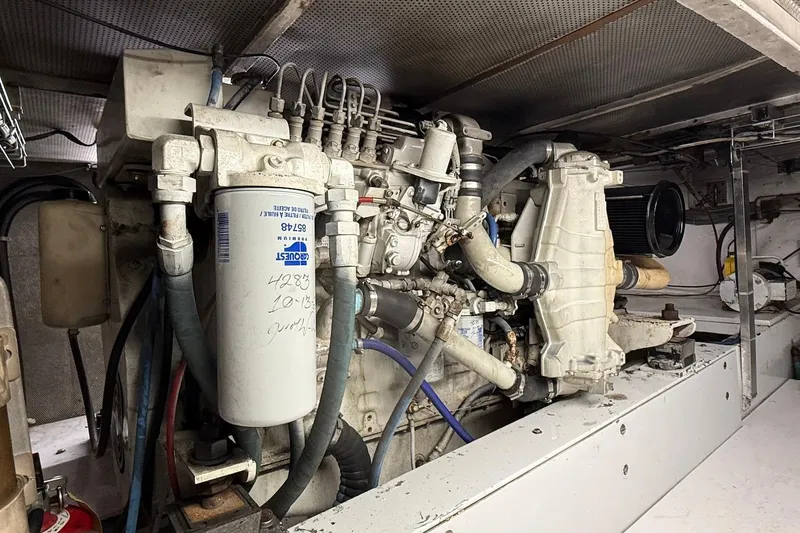 Slide: The Image of Engine room of a 1963 Rybovich 45 Convertible boat, showcasing mechanical components. - 57