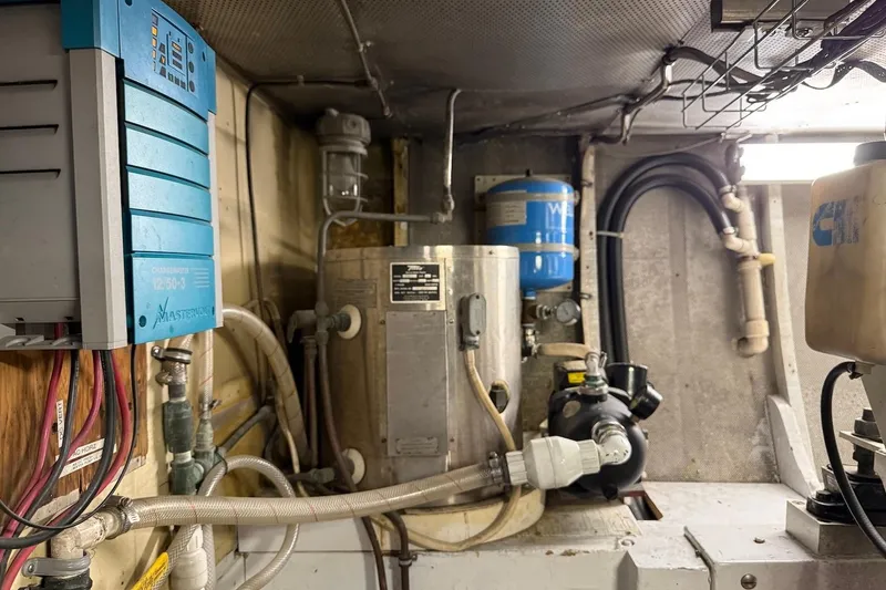 Slide: The Image of Engine room of a 1963 Rybovich 45 Convertible boat, featuring various mechanical components. - 61