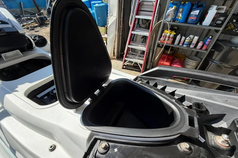 Slide: The Image of 2022 Yamaha WaveRunner VX Cruiser storage compartment open in a garage setting. - 11