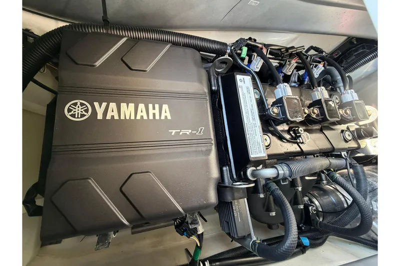 Slide: The Image of Engine compartment of 2022 Yamaha WaveRunner VX Cruiser, featuring TR-1 engine components. - 12