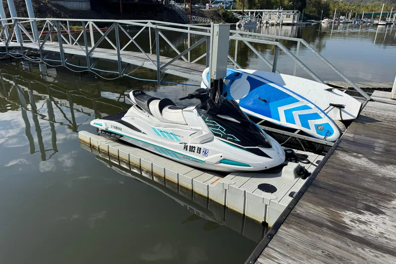 Slide: The Image of 2022 Yamaha WaveRunner VX Cruiser docked beside a paddleboard on a sunny day. - 18