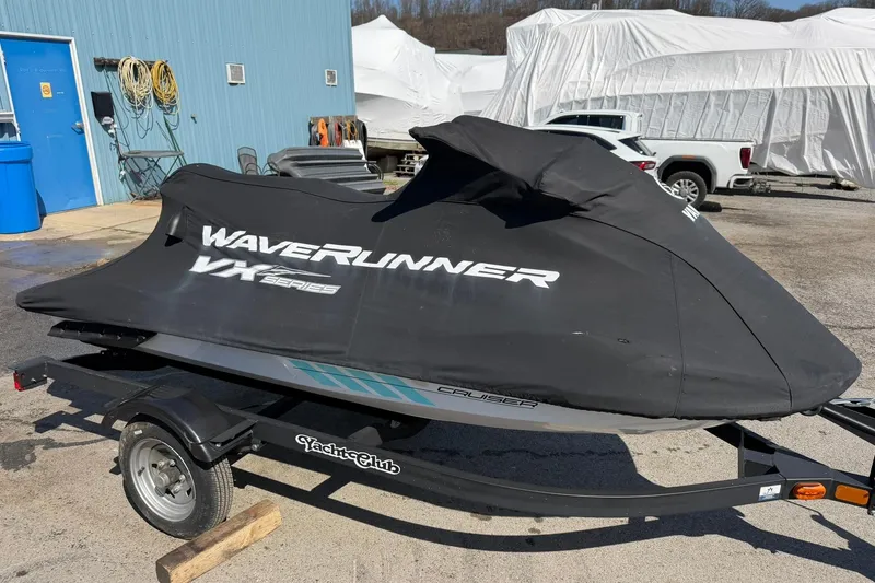 Slide: The Image of 2022 Yamaha WaveRunner VX Cruiser covered on trailer, parked outdoors. - 2