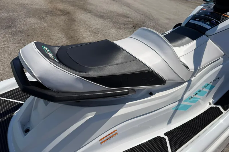 Slide: The Image of 2022 Yamaha WaveRunner VX Cruiser, sleek white and black seat design, outdoor setting. - 3