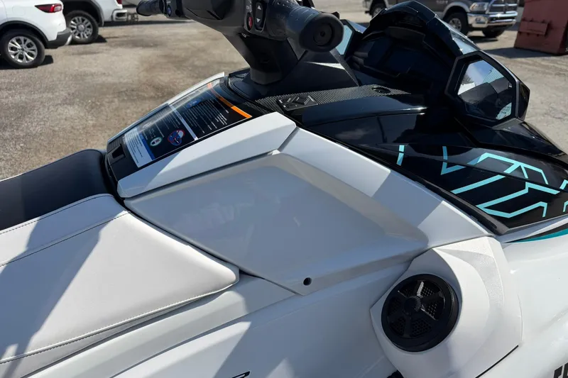 Slide: The Image of 2022 Yamaha WaveRunner VX Cruiser, white and black design, parked outdoors. - 5