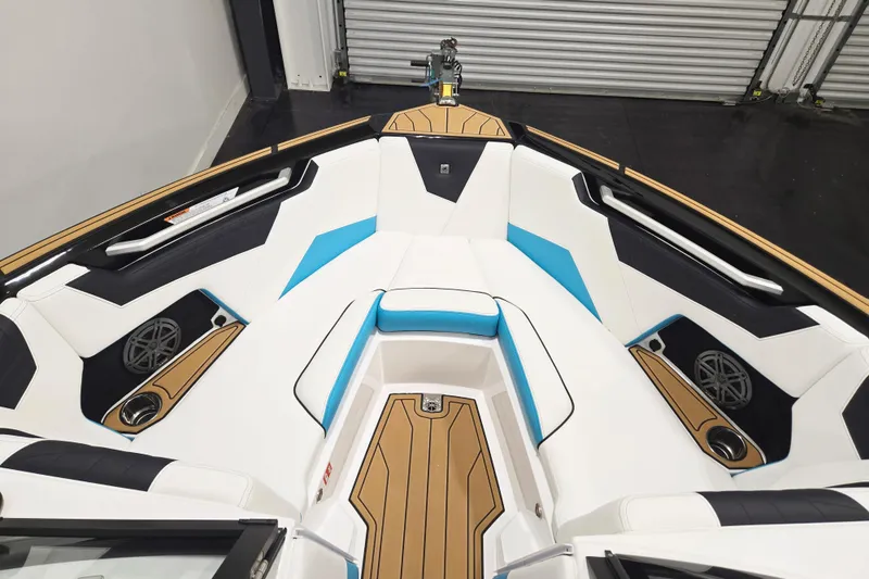 Slide: The Image of 2026 Nautique Super Air Nautique S21 boat interior with stylish seating and modern design. - 6