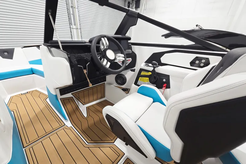 Slide: The Image of Interior of 2026 Nautique Super Air Nautique S21 boat with modern helm and seating. - 8