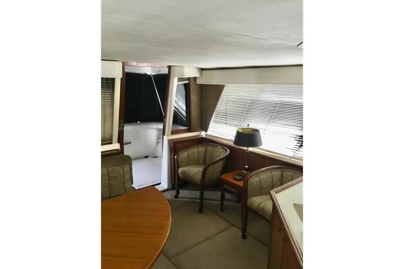 Slide: The Image of Interior of 1994 Bayliner 4788 Pilot House Motoryacht with seating and table. - 7
