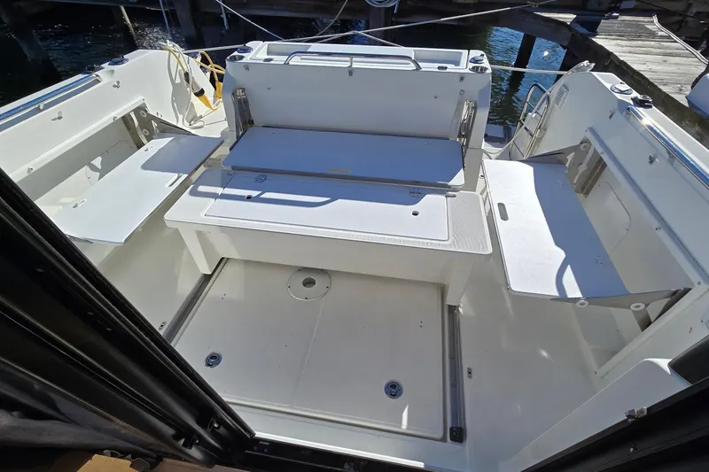 Slide: The Image of Beneteau Barracuda 27 (2020) boat interior with seating and storage compartments. - 3