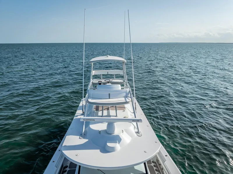 Slide: The Image of 2023 Yellowfin 54 boat on open water. - 19