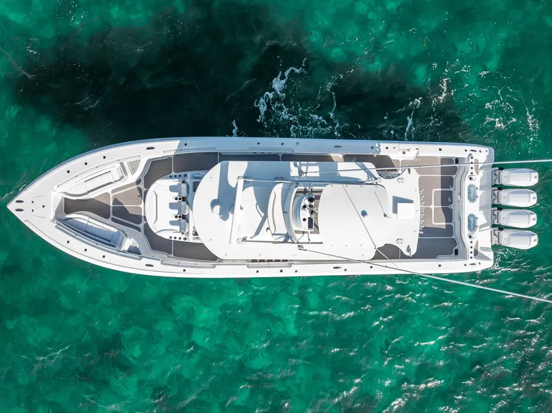 Slide: The Image of Aerial view of a 2023 Yellowfin 54 boat on clear turquoise water. - 22