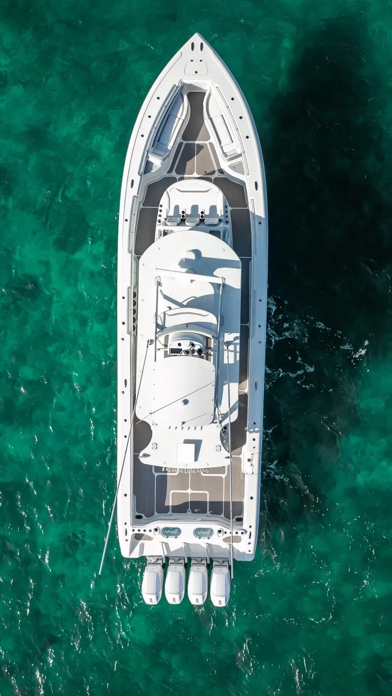 Slide: The Image of Aerial view of 2023 Yellowfin 54 yacht on turquoise water. - 23
