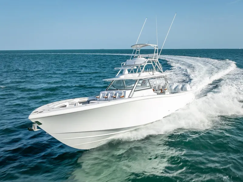 Slide: The Image of 2023 Yellowfin 54 boat cruising on open water. - 24
