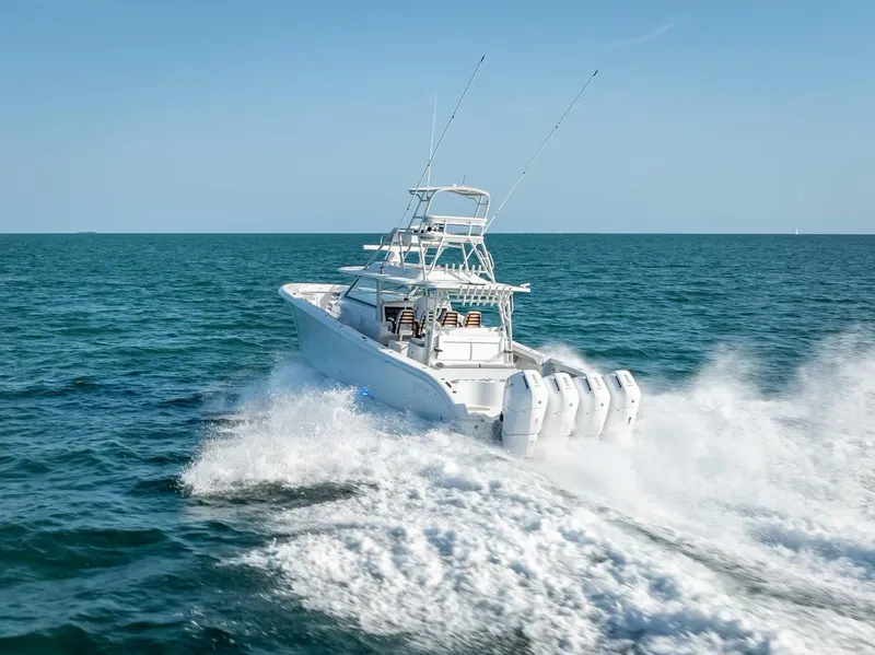 Slide: The Image of 2023 Yellowfin 54 boat cruising on open water. - 29