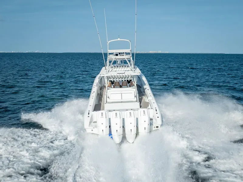 Slide: The Image of 2023 Yellowfin 54 boat speeding on open water. - 34