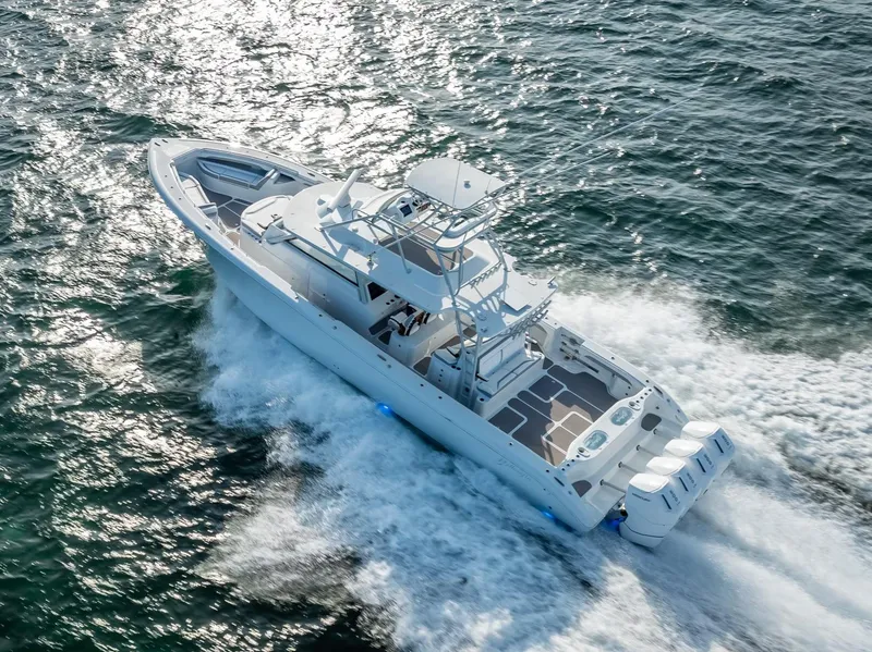 Slide: The Image of 2023 Yellowfin 54 boat cruising on open water. - 38