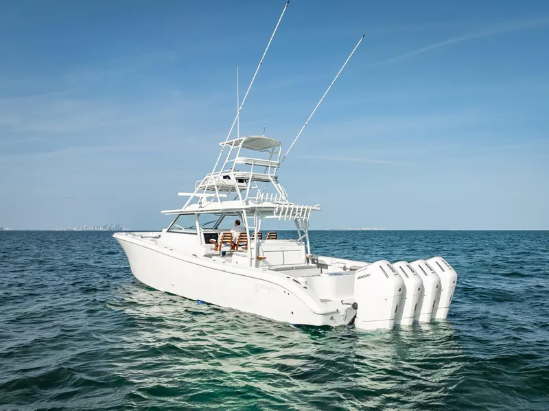 Slide: The Image of 2023 Yellowfin 54 boat with multiple outboard engines on open water. - 40