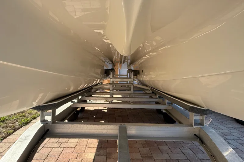 Slide: The Image of Underneath view of a 2014 Carolina Cat 23DC boat on a trailer. - 12