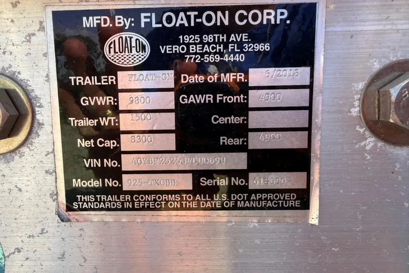 Slide: The Image of Metallic trailer identification plate from Float-On Corp, detailing specifications and manufacturing information. - 17