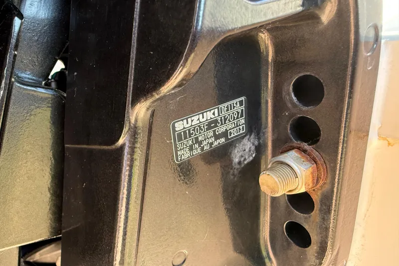 Slide: The Image of Close-up of Suzuki motor label on Carolina Cat 23DC, 2014 model. - 19