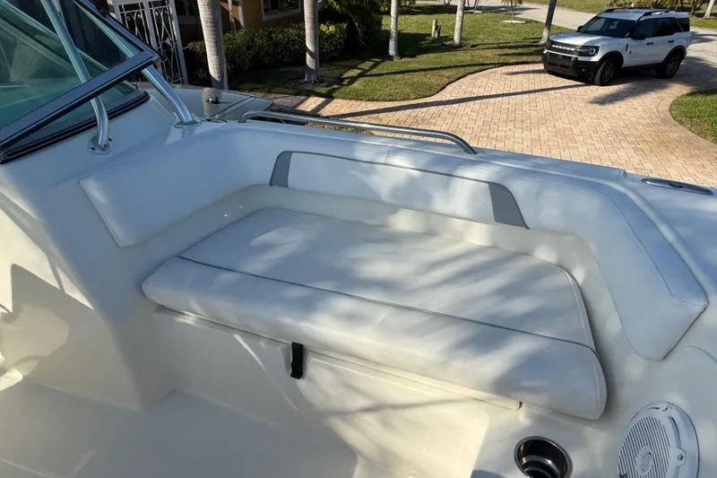 Slide: The Image of 2014 Carolina Cat 23DC boat interior with cushioned seating and speaker. - 55