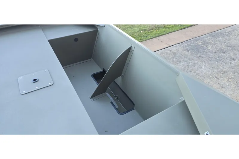Slide: The Image of 2026 Tracker Grizzly 1648 Utility boat interior with storage compartment and seating area. - 6