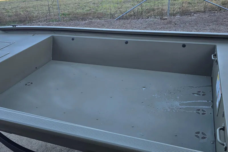 Slide: The Image of Interior view of 2026 Tracker Grizzly 1648 Utility boat, showcasing spacious, durable design. - 5