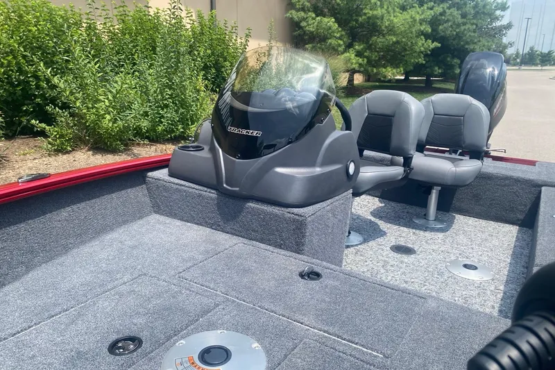 Slide: The Image of 2026 Tracker Super Guide V-16 SC boat interior with seating and console. - 4