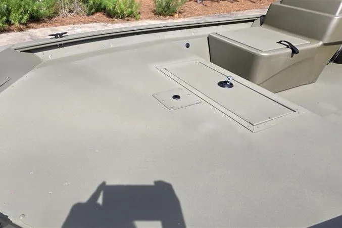 Slide: The Image of 2026 Tracker Grizzly 1754 SC boat interior with storage compartment and seating. - 6