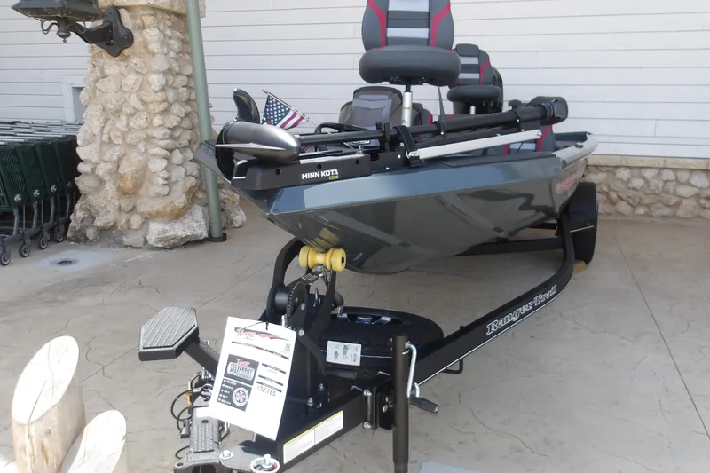 The Image of 2026 Ranger RT178 boat on trailer with Minn Kota motor and American flag. - 1