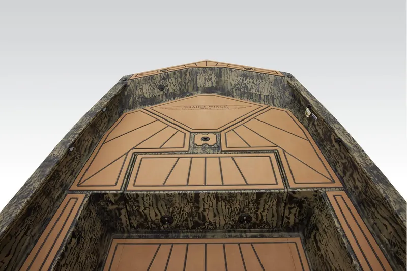 Slide: The Image of 2026 Tracker Grizzly 1650 T Prairie Wings Edition boat interior with custom flooring. - 8