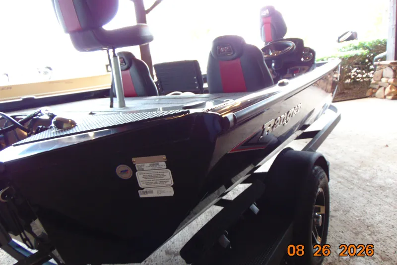 Slide: The Image of 2026 Ranger RT188P boat with red and black seats on a trailer. - 3
