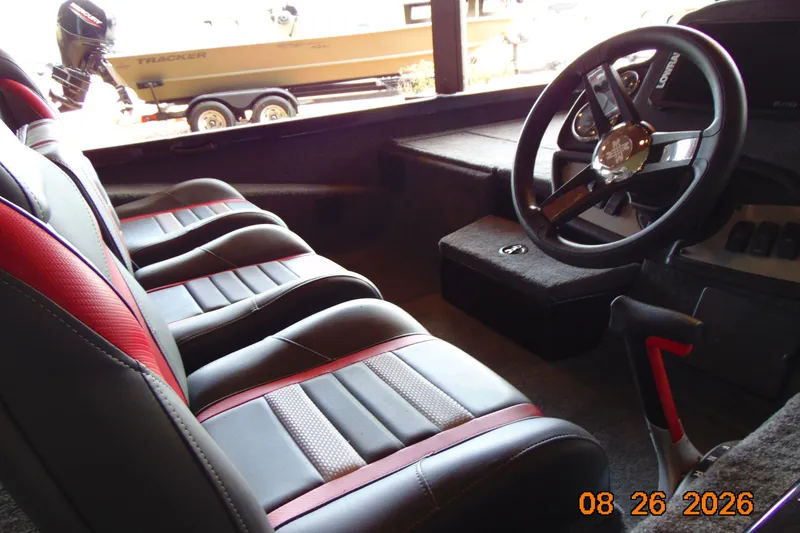 Slide: The Image of Interior of 2026 Ranger RT188P boat with steering wheel and seating. - 6