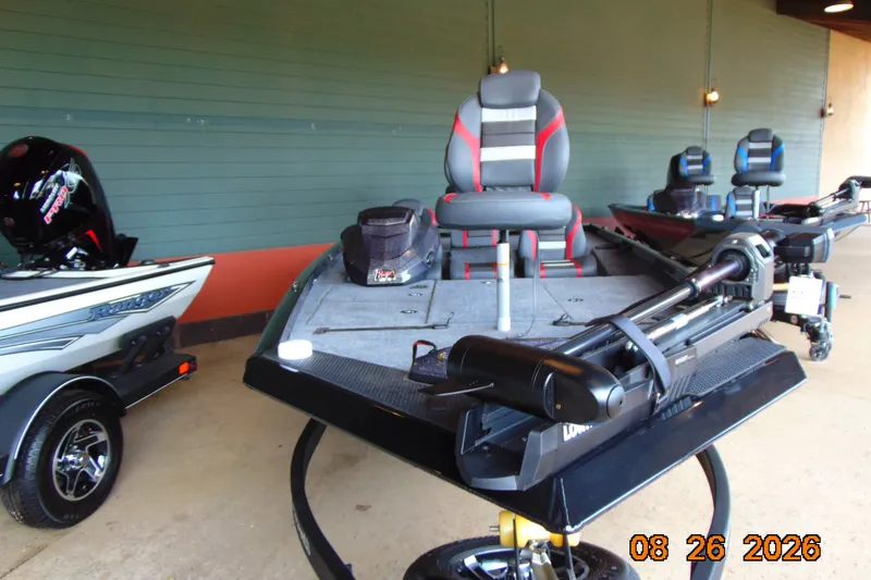 Slide: The Image of 2026 Ranger RT188P boat with advanced seating and motor, displayed indoors. - 8