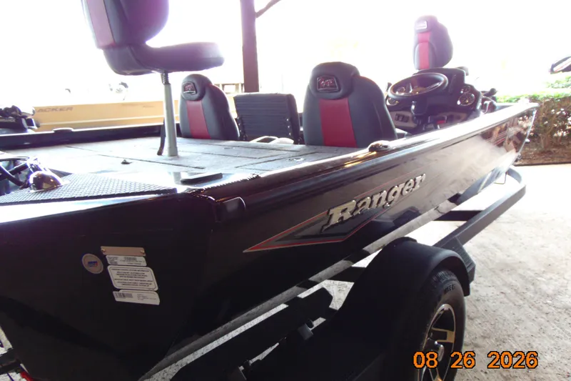 Slide: The Image of 2026 Ranger RT188P boat with red and black seats on a trailer. - 5