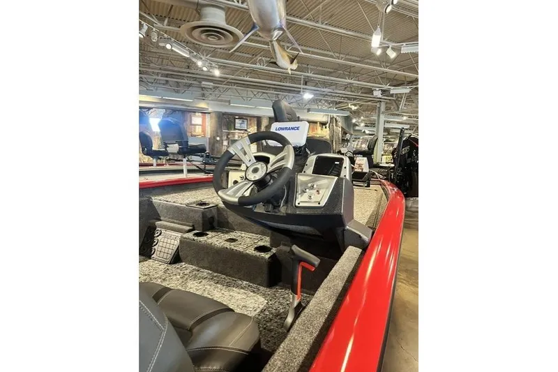 The Image of 2026 Tracker Pro Team 195 boat interior with steering wheel and navigation system. - 0