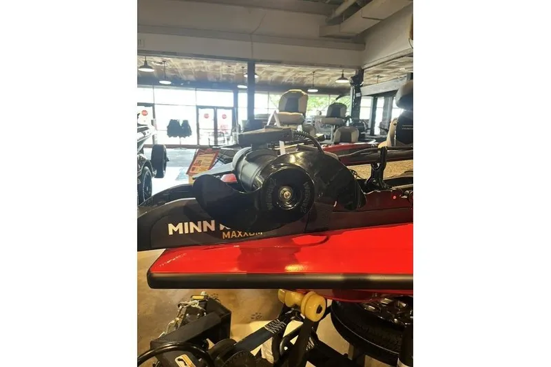 Slide: The Image of 2026 Tracker Pro Team 195 boat with Minn Kota Maxxum trolling motor in showroom. - 5